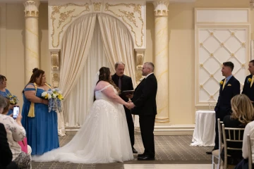 Jeff McQueen officiating a ballroom wedding ceremony