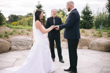 Jeff McQueen officiating an outdoor garden ceremony