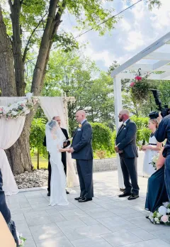 Jeff McQueen officiating a courtyard wedding ceremony